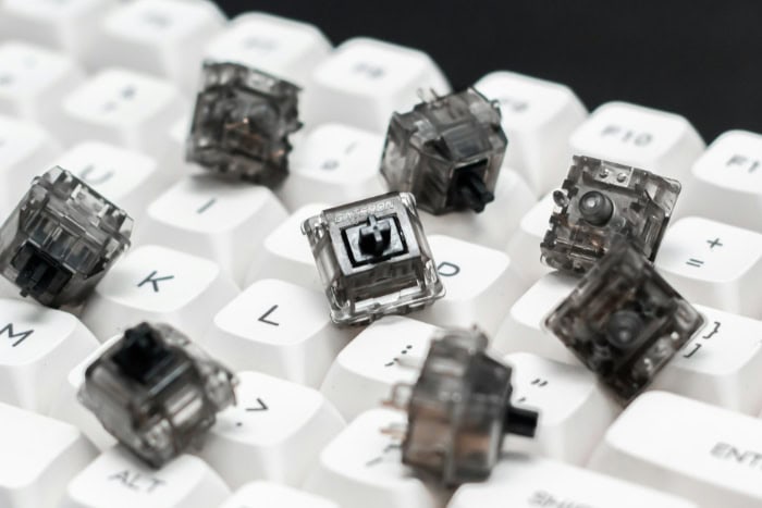 Close up of mechanical keyboard switches on white keycaps