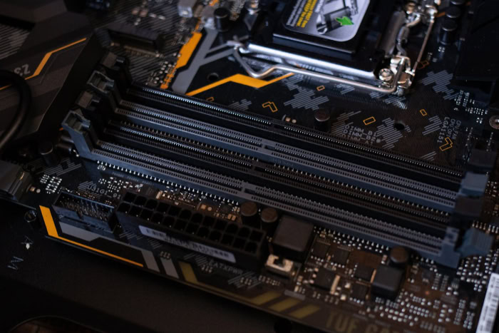 Close up of motherboard showing PCIe and RAM slots