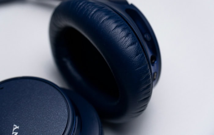 Close up of navy blue over ear headphone cushion