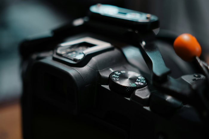 Close up view of a digital camera mode dial