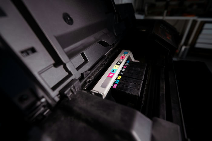 Close up view of labeled printer ink cartridges