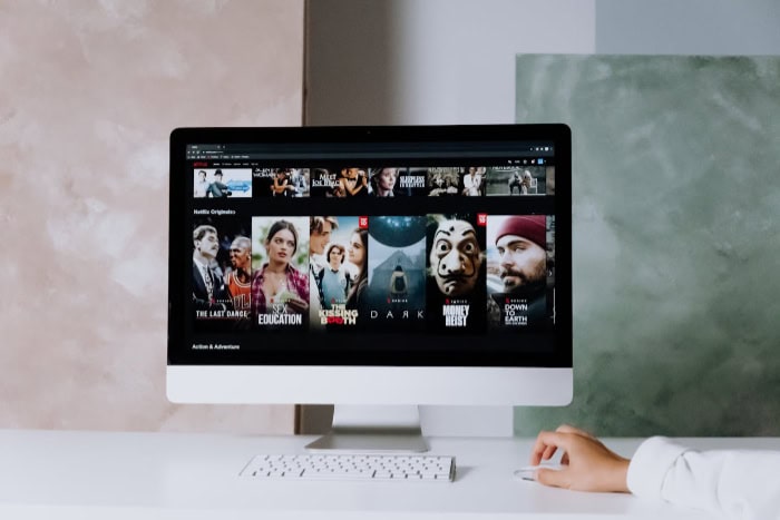 Computer screen displaying Netflix with various thumbnails