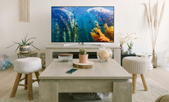 Cozy home interior with vibrant TV screen and bohemian decor