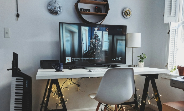 Cozy home office setup with a large screen TV