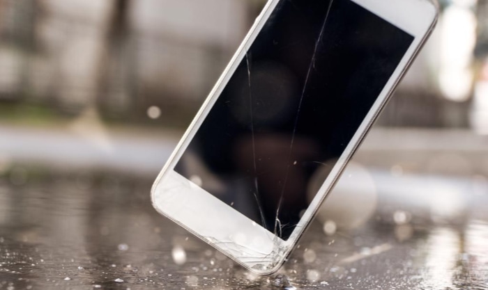 Cracked white smartphones screen