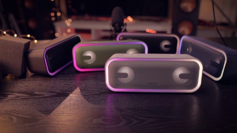 Multiple black DOSS SoundBox Pro+ on black wooden table