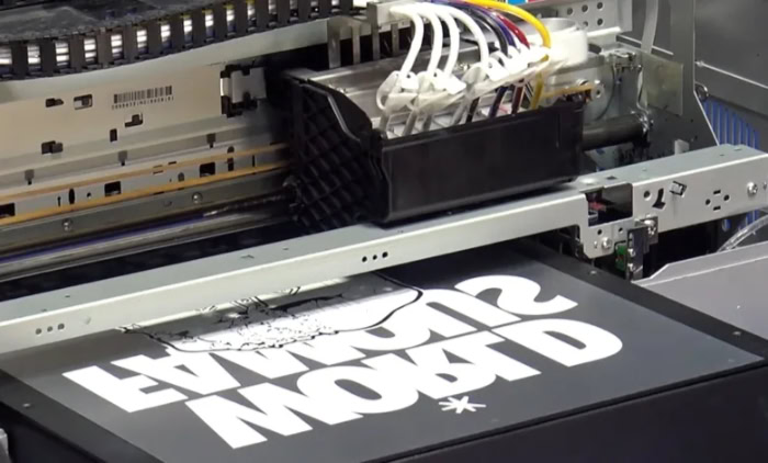 DTF printer applying white ink onto transfer film