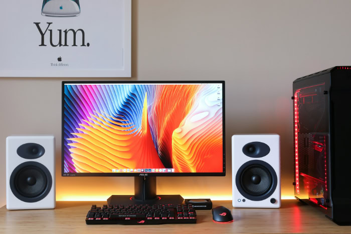Desktop computer setup with monitor speakers and keyboard