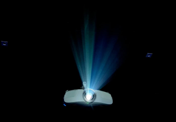 Digital projector emitting bright beam in dark room