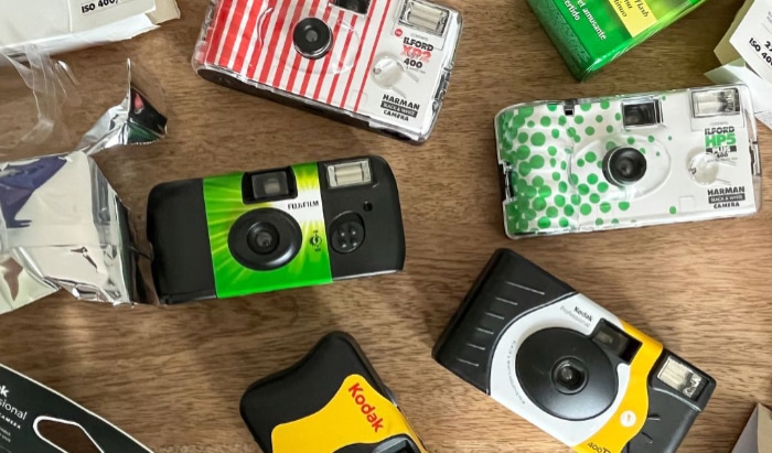 Disposable cameras on wooden floor