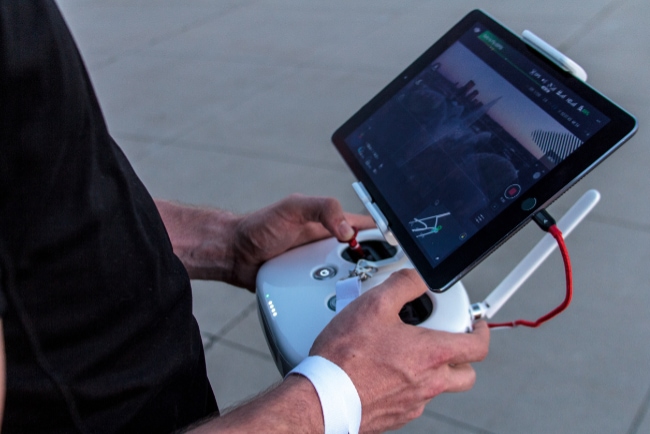 person holding drone controller
