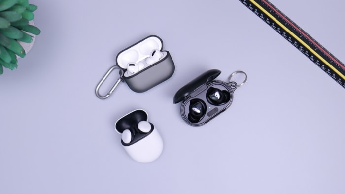 AirPods Pro, Pixel Buds, and Buds+ on white surface
