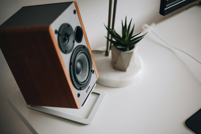 Edifier bookshelf speaker on an angled desktop stand