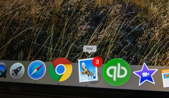 Email application icon with unread message notifications on a computer dock