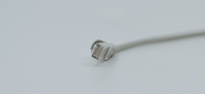 Gray ethernet cable on gray surface