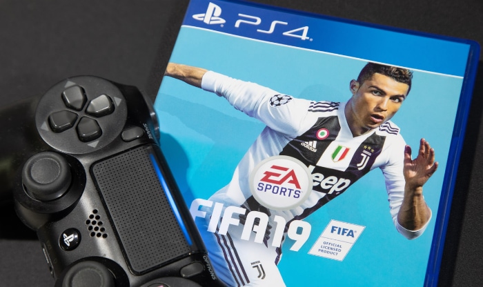 FIFA19 PS4 Disc near controller