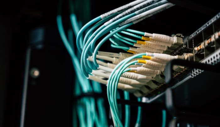 Fiber optic cables connected to network switch in data center