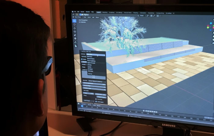 Game developer designing 3D assets on computer