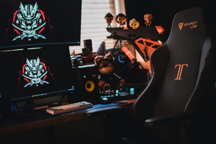 Gaming chair and dual screen setup with accessories