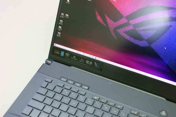 Gaming laptop with open screen and visible desktop icons