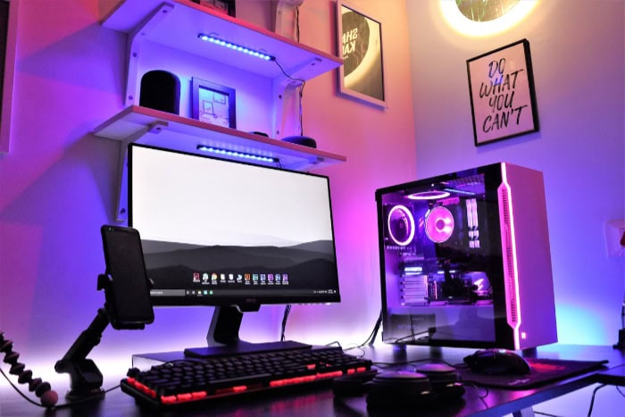 Gaming setup with custom PC and RGB lighting