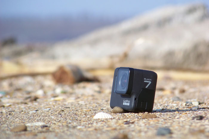 GoPro Hero7 Black camera on sandy beach