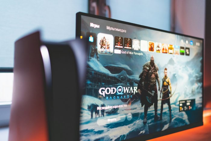 God of War Ragnarok menu screen on a gaming monitor