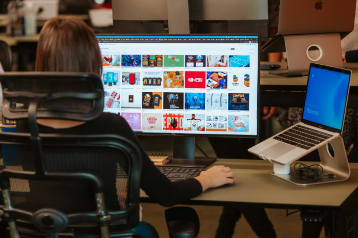 Graphic designer working on computer screen at office resized