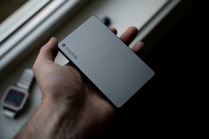 Hand holding a slim and portable power bank