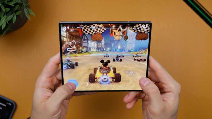 Hands gaming on foldable phones large screen