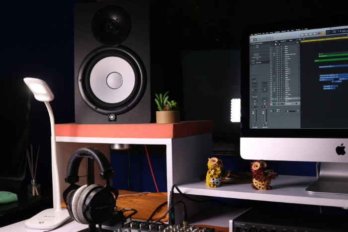 Home music production workspace with studio monitors