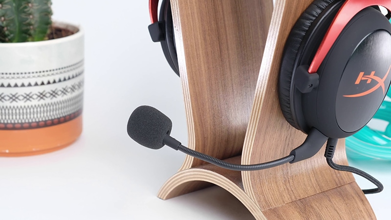 Black HyperX Cloud II on wooden headphone stand