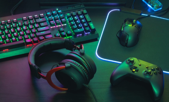 Illuminated gaming gear with keyboard mouse headphones and controller