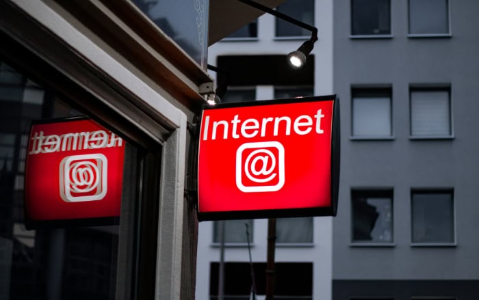 Illuminated red sign displaying internet symbol