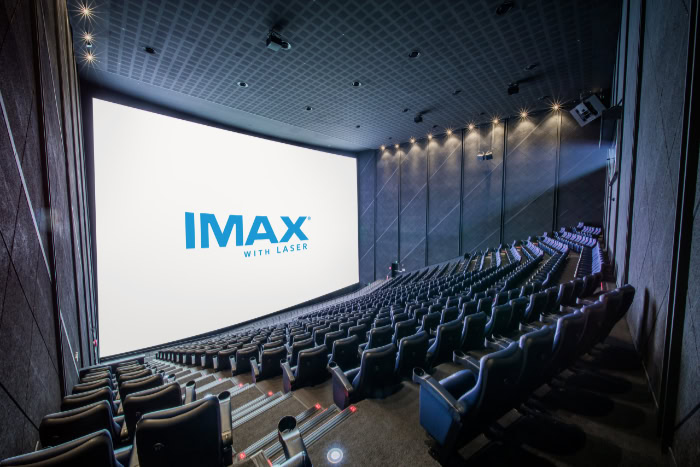 Interior of an empty IMAX laser cinema auditorium