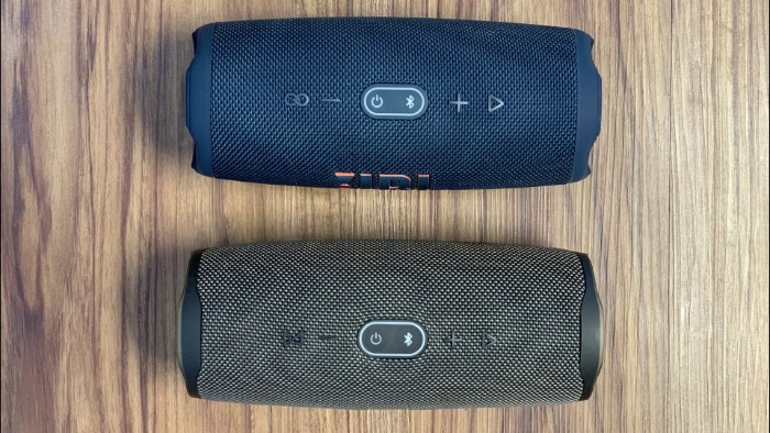 Top view of JBL Charge 4 and Charge 5 on wooden floors
