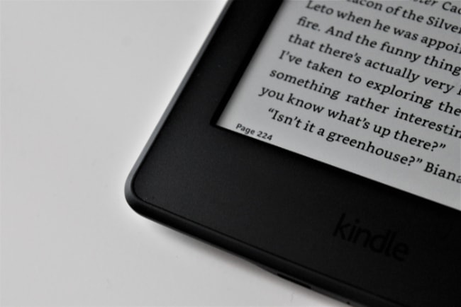 Close up of black kindle on white surface