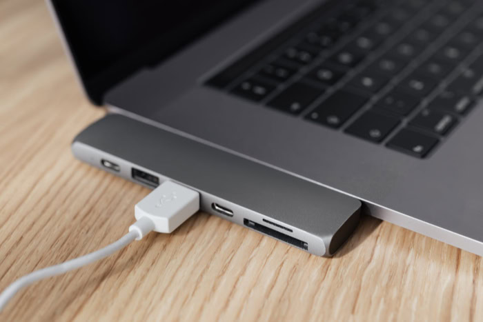 Laptop USB C hub with white cable plugged in