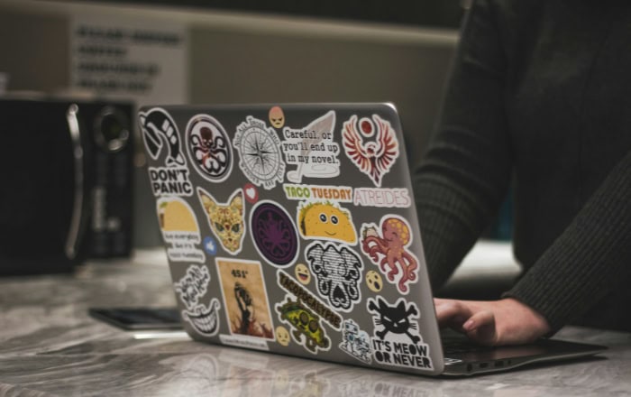 Laptop covered in diverse stickers