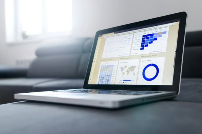 Laptop displaying analytics and website performance graphs