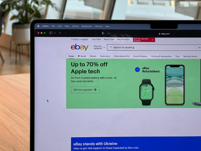 Laptop displaying eBay discounts on Apple technology