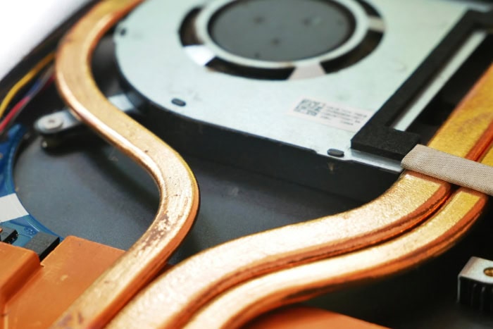 Laptop heat pipes and cooling fan system close up