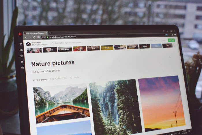 Laptop screen showing nature pictures on Unsplash website