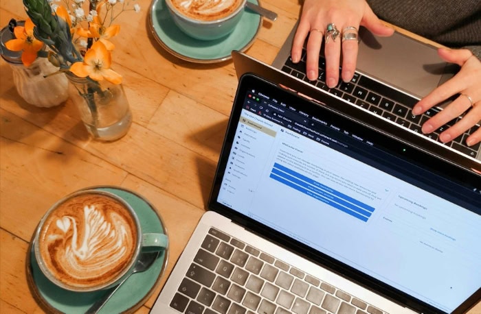 Laptops and coffee on a wooden table