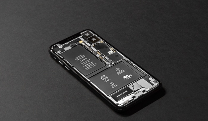 Internal components of smartphone with lithium-ion battery visible