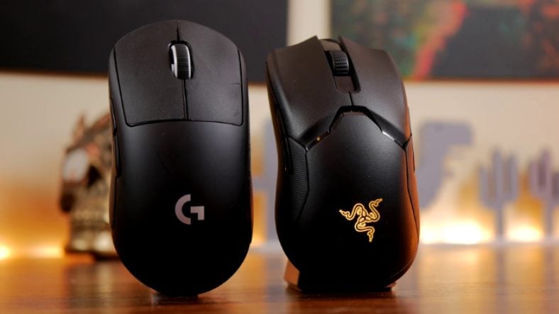 Black Logitech G Pro Wireless beside black Razer Viper Ultimate Close up on wooden table