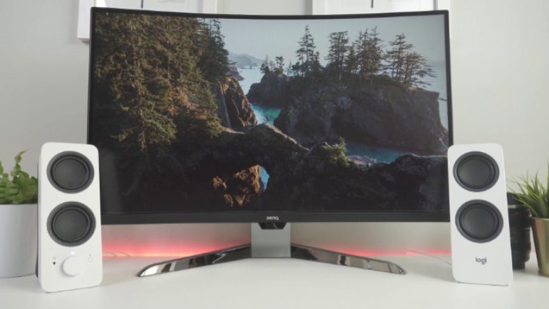 White Logitech Z207 in front of black monitor