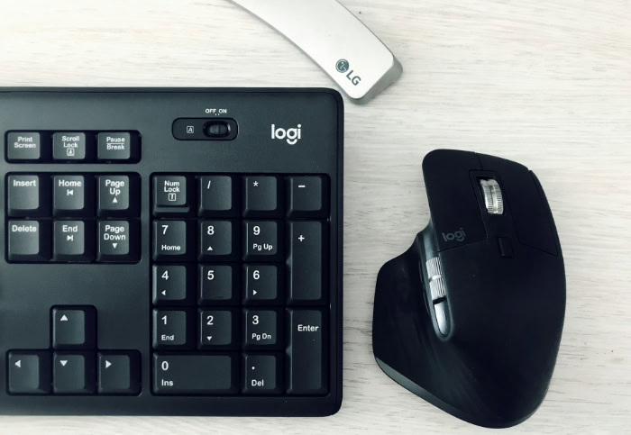 Logitech keyboard and wireless ergonomic mouse on desk