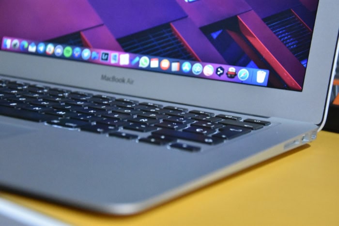 MacBook Air keyboard and screen showing macOS dock