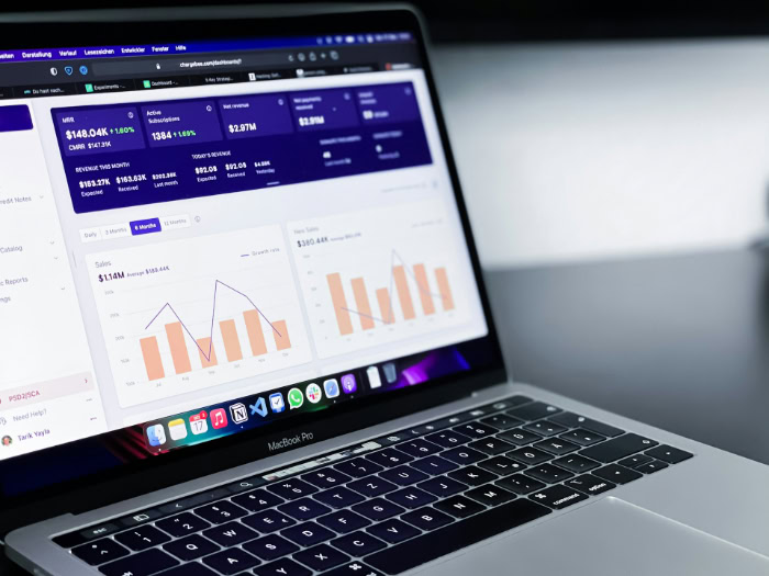 MacBook Pro showing SaaS revenue and subscription analytics dashboard